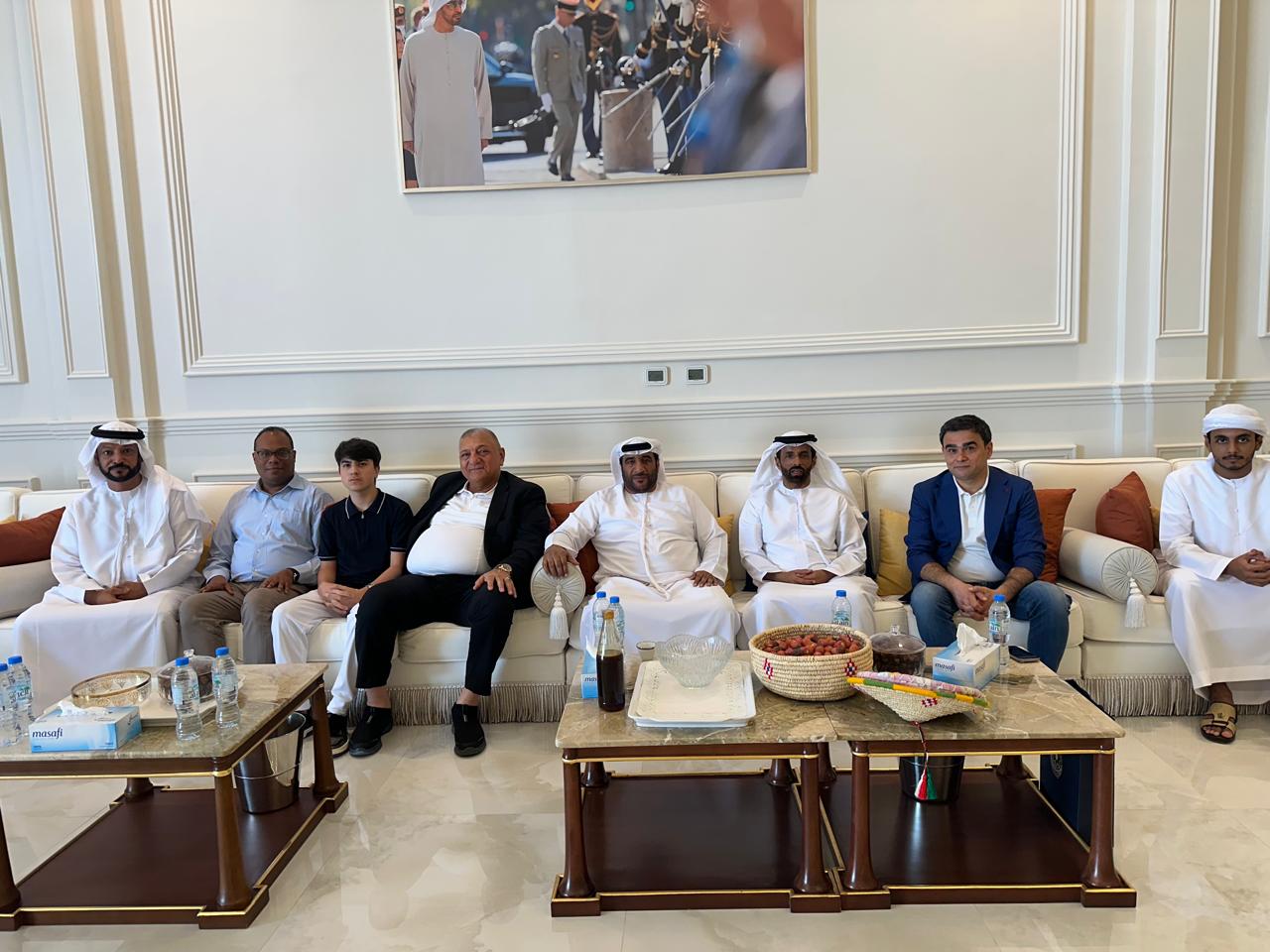 Seated gathering in the Majlis